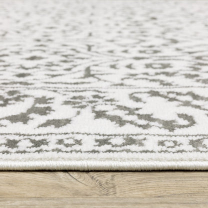 7' X 10' Gray And White Floral Distressed Area Rug