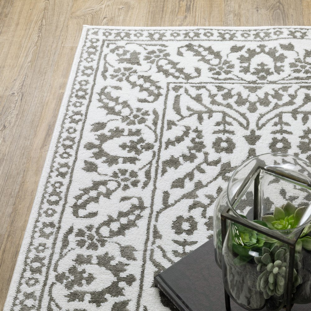 7' X 10' Gray And White Floral Distressed Area Rug