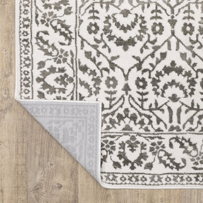 7' X 10' Gray And White Floral Distressed Area Rug