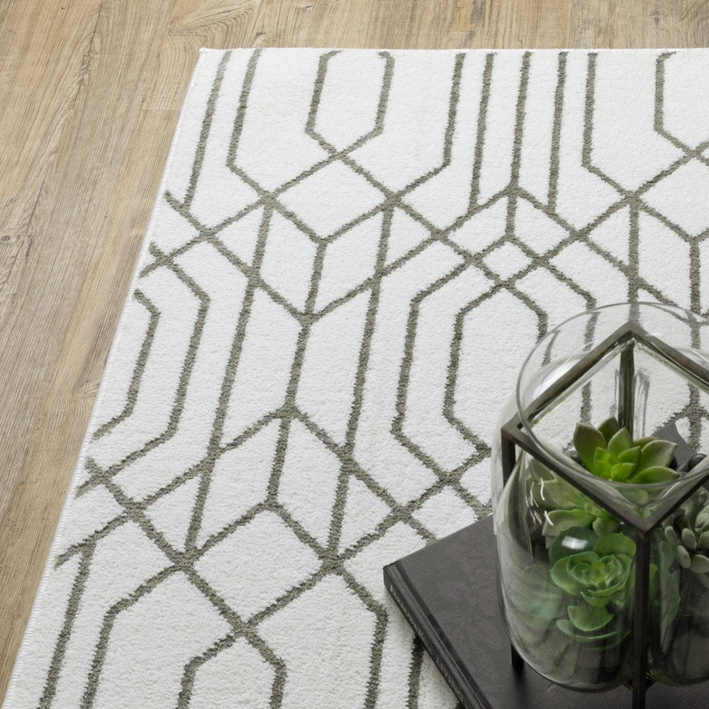 2' x 8' white and grey geometric runner rug, power loom construction, stain resistant.