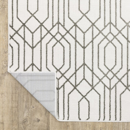 2' x 8' white and grey geometric power loom runner rug, stain resistant.