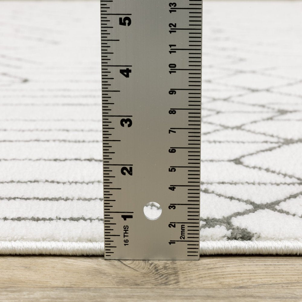 2' x 8' white and grey geometric power loom runner rug, stain resistant.