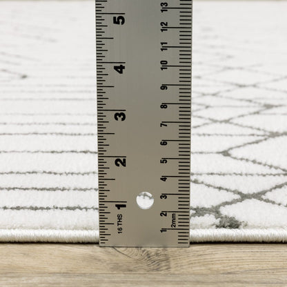 2' x 8' white and grey geometric power loom runner rug, stain resistant.