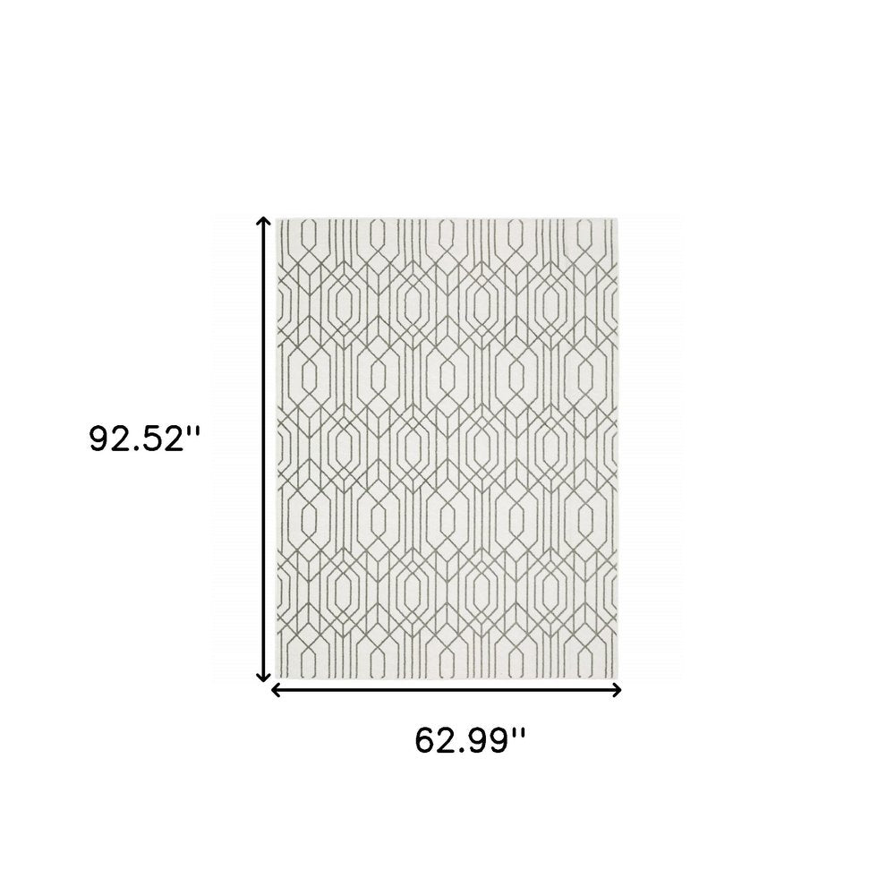 5' x 8' white and grey geometric area rug, power loom construction, stain resistant.