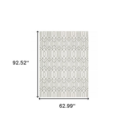 5' x 8' white and grey geometric area rug, power loom construction, stain resistant.