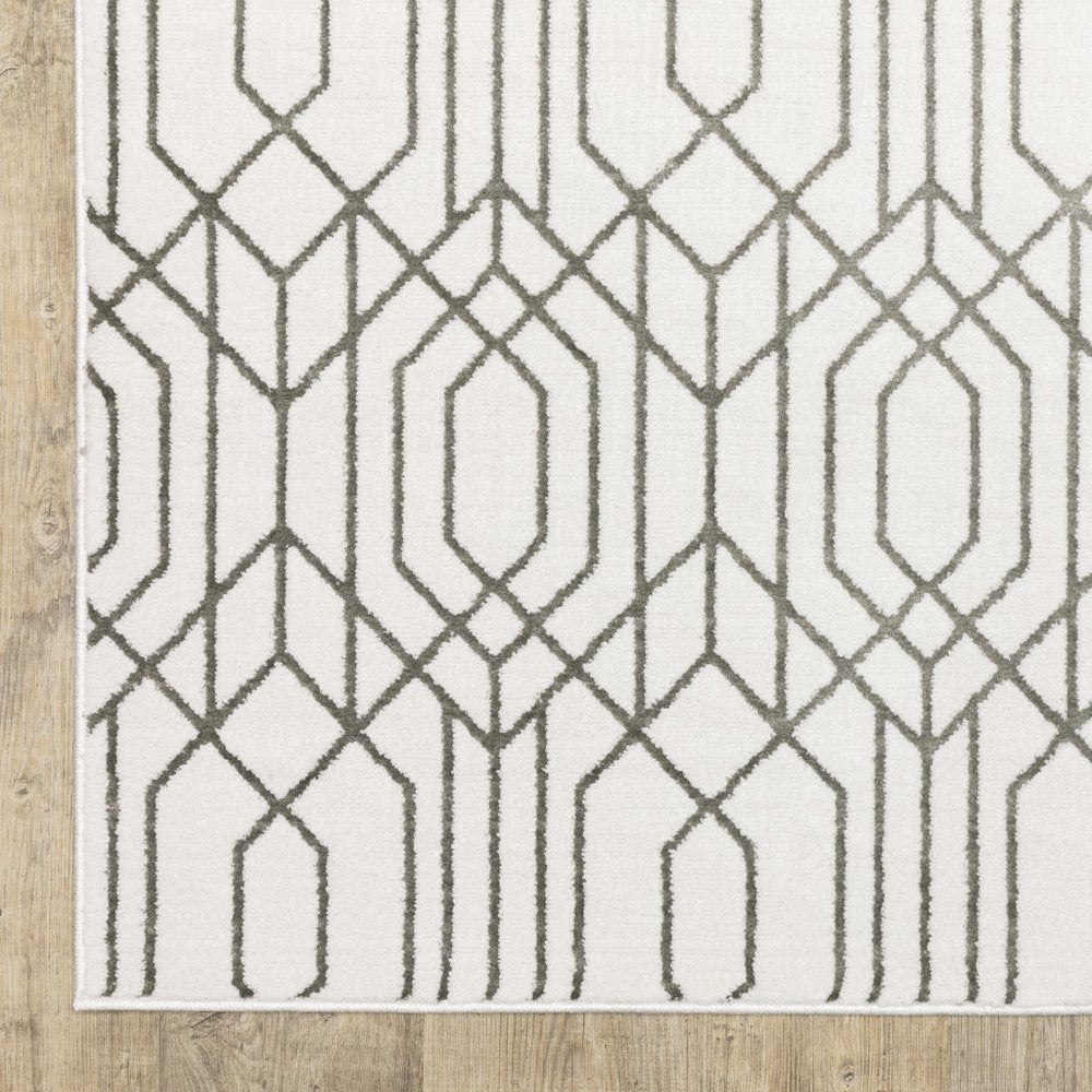 5' x 8' white and grey geometric power loom stain resistant area rug