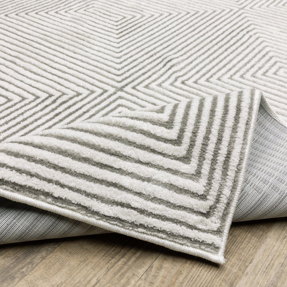 2' x 8' grey and white geometric power loom stain resistant runner rug