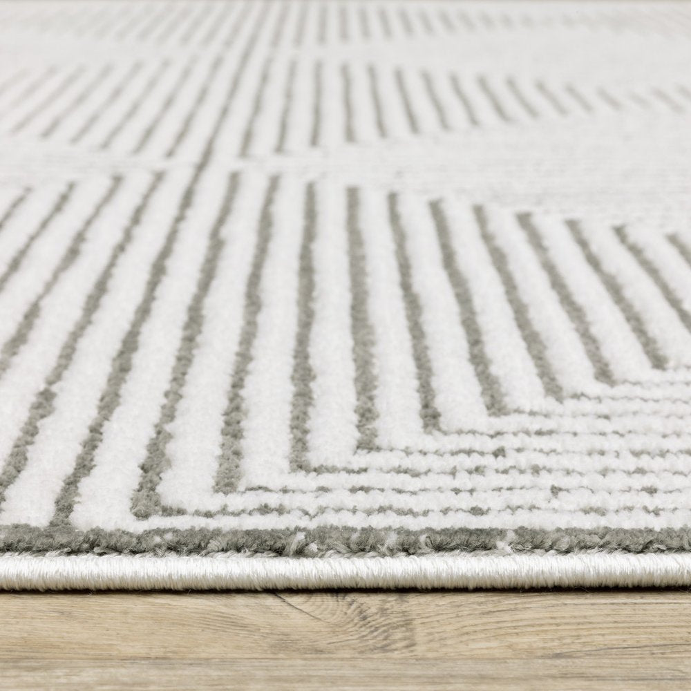 7' X 10' Gray And White Geometric Distressed Area Rug