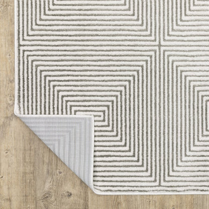 7' X 10' Gray And White Geometric Distressed Area Rug