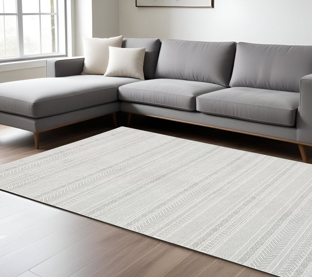 8' X 11' white and gray geometric distressed area rug