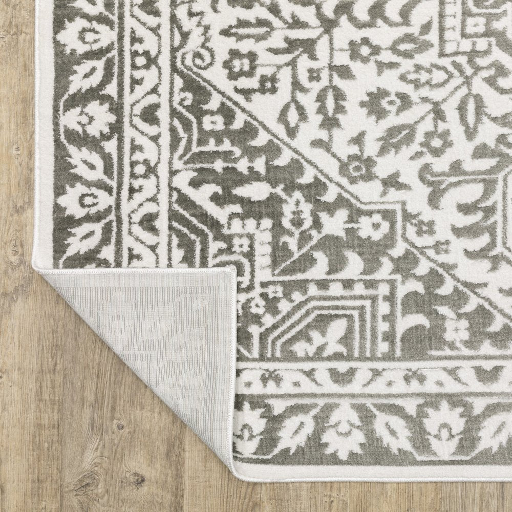 8' x 11' gray & white distressed oriental area rug.