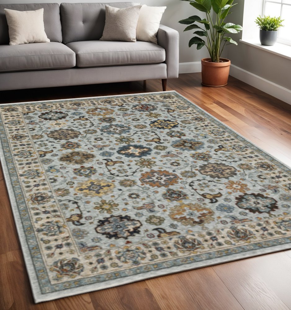 5' X 8' Blue Beige Grey Green Yellow And Rust Oriental Power Loom Stain Resistant Area Rug With Fringe