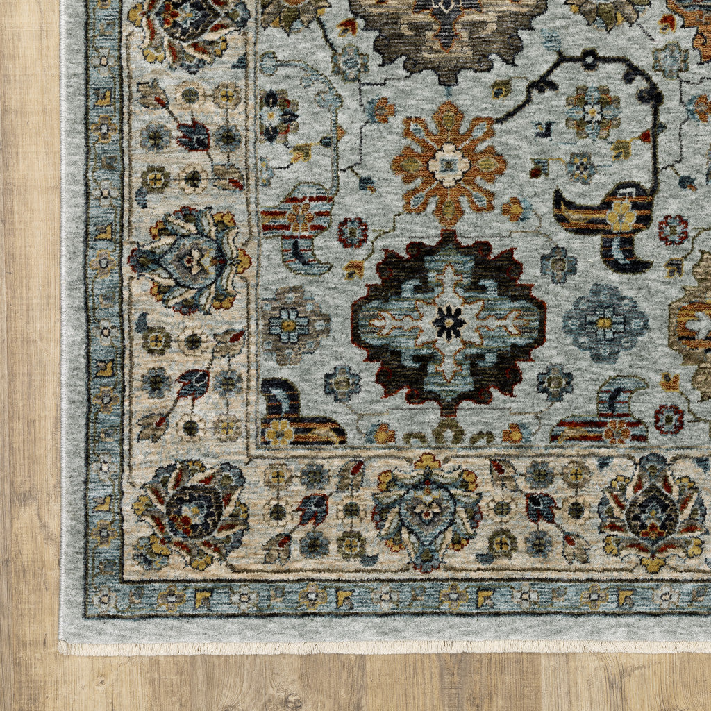 8' X 11' Blue Beige Grey Green Yellow And Rust Oriental Power Loom Stain Resistant Area Rug With Fringe