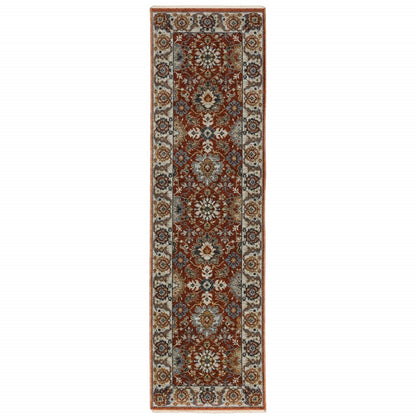 2' X 8' Red Blue Ivory Gold And Navy Oriental Power Loom Stain Resistant Runner Rug With Fringe