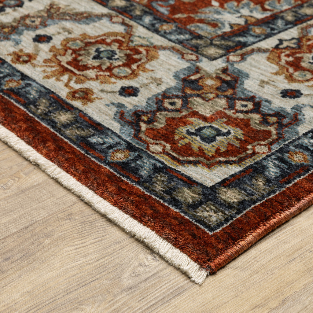 2' X 8' Red Blue Ivory Gold And Navy Oriental Power Loom Stain Resistant Runner Rug With Fringe