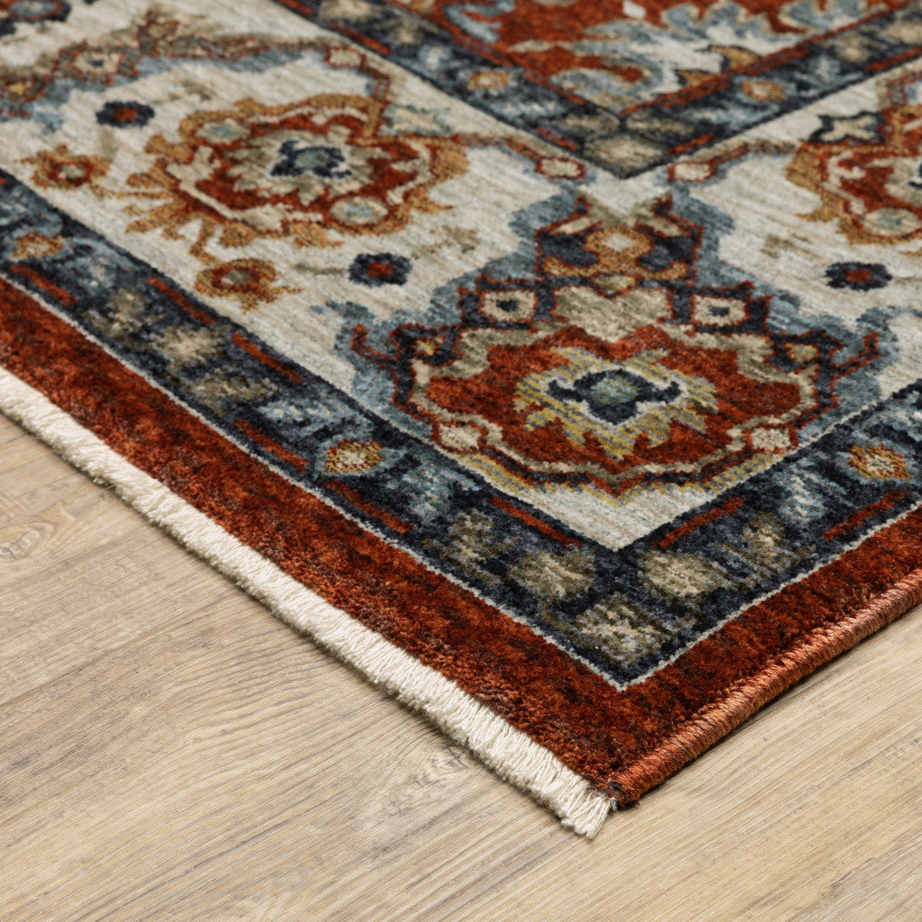 5' X 8' Red Blue Ivory Gold And Navy Oriental Power Loom Stain Resistant Area Rug With Fringe