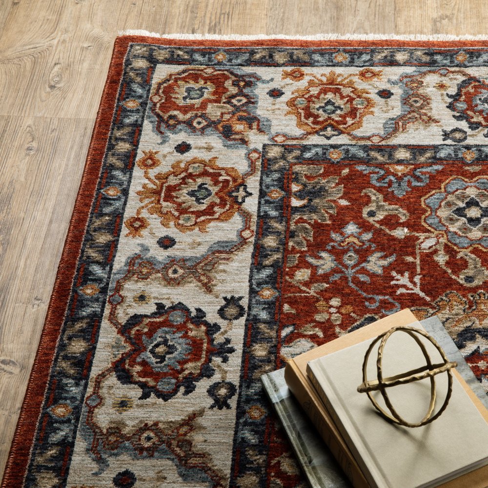 7' X 10' Red Ivory And Orange Oriental Area Rug With Fringe