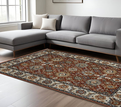 8' X 11' Red Ivory And Orange Oriental Area Rug With Fringe