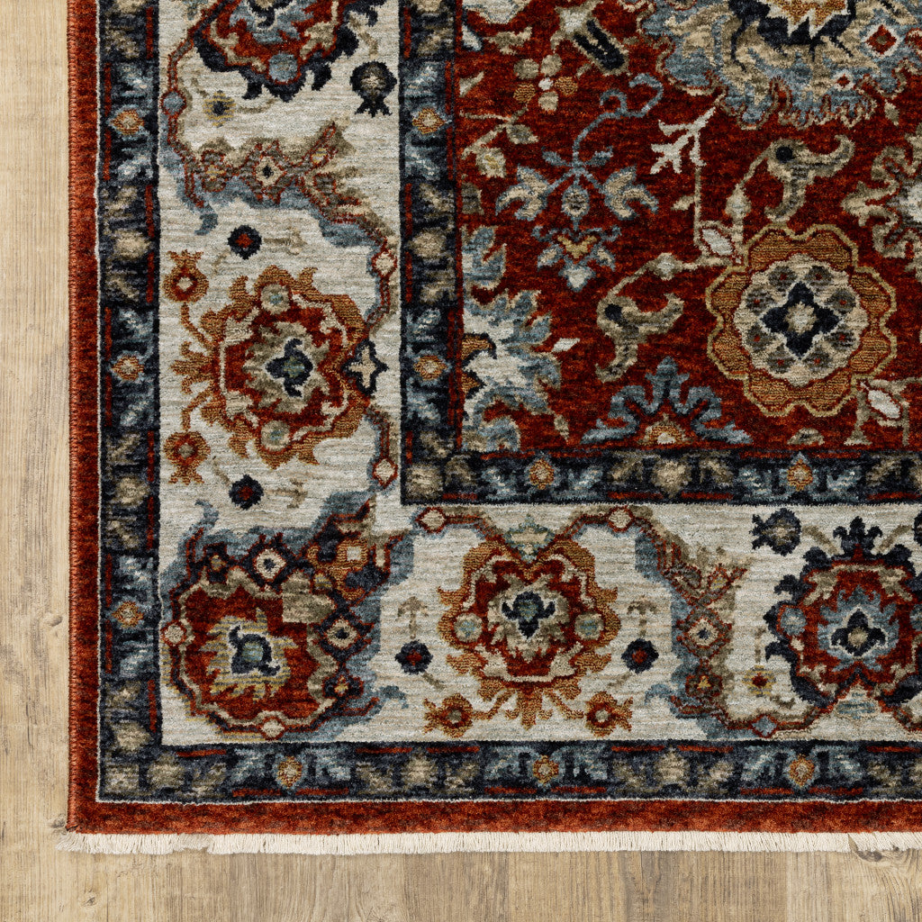 8' X 11' Red Blue Ivory Gold And Navy Oriental Power Loom Stain Resistant Area Rug With Fringe