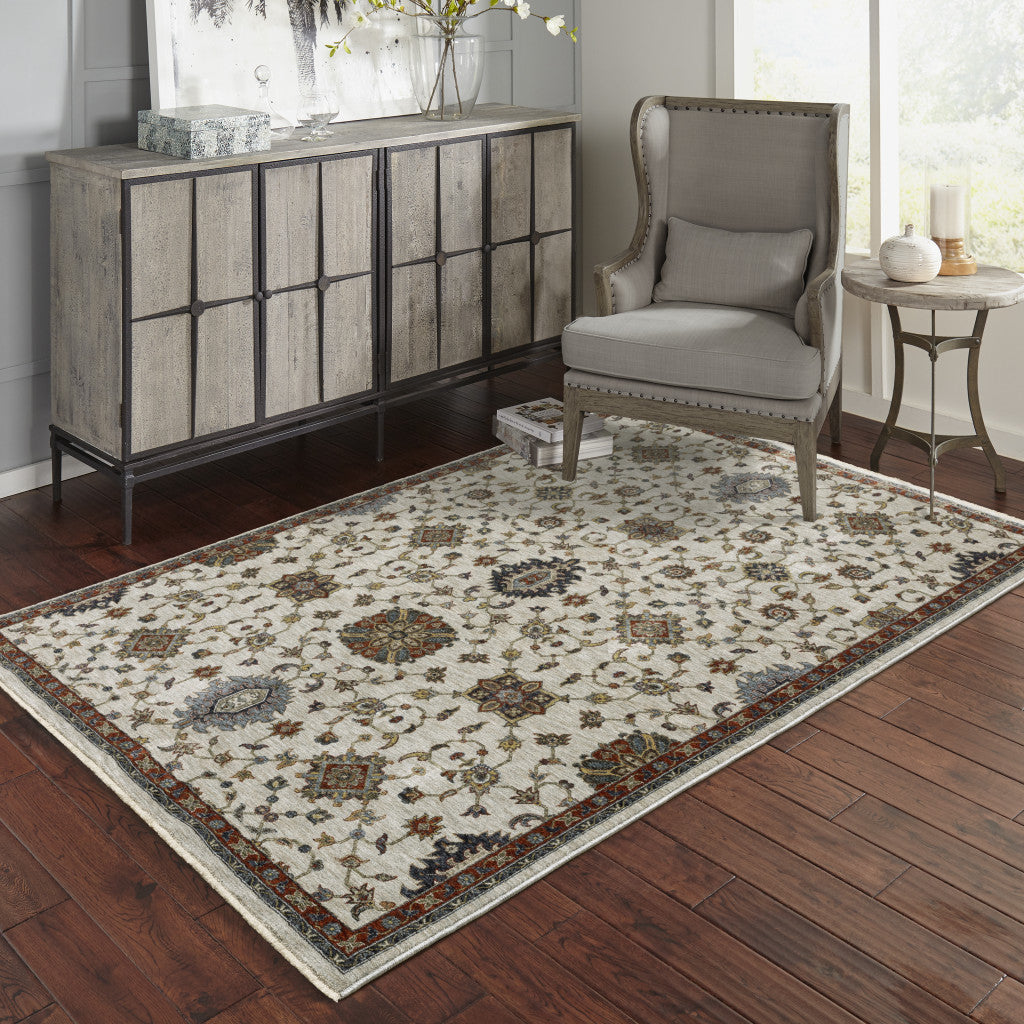 5' X 8' Beige Rust Red Blue Gold And Grey Oriental Power Loom Stain Resistant Area Rug With Fringe