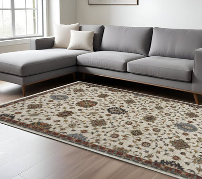 10' X 13' Beige Rust Red Blue Gold And Grey Oriental Power Loom Stain Resistant Area Rug With Fringe