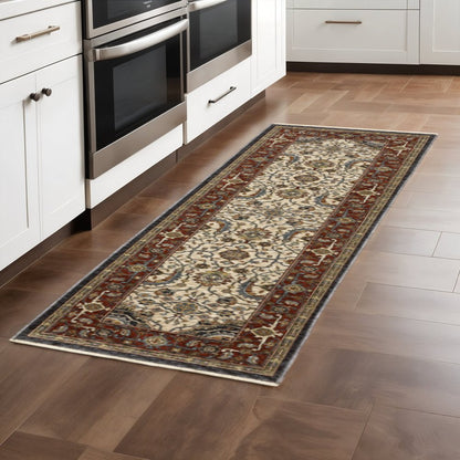 2' X 8' Ivory Beige Red Blue Gold Green And Navy Oriental Power Loom Stain Resistant Runner Rug With Fringe