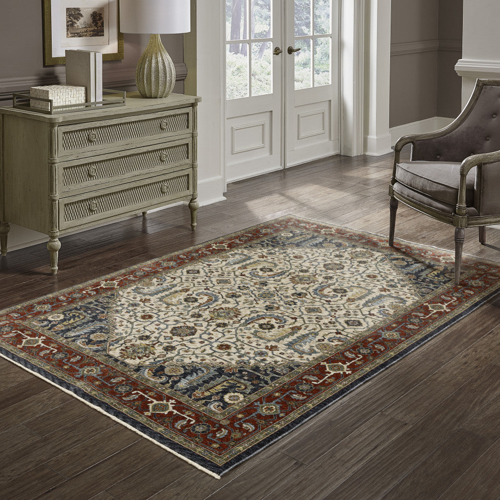5' X 8' Ivory Beige Red Blue Gold Green And Navy Oriental Power Loom Stain Resistant Area Rug With Fringe