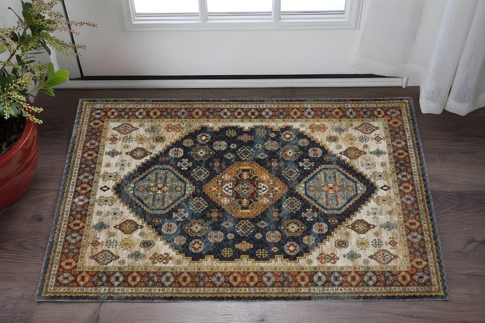 3' X 5' Blue Red Beige Orange Gold And Tan Oriental Power Loom Stain Resistant Area Rug With Fringe