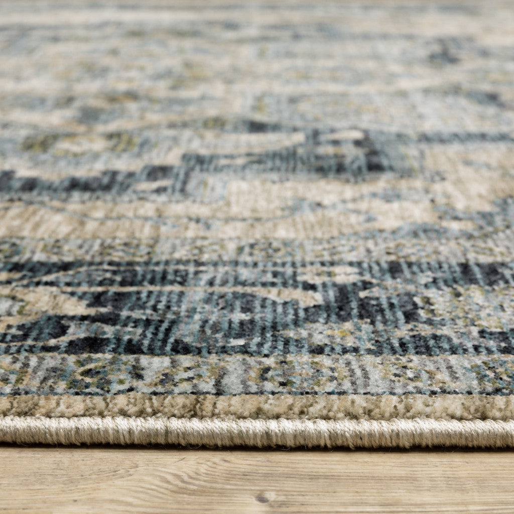 5' X 8' Blue Grey Beige Tan Green And Gold Oriental Power Loom Stain Resistant Area Rug With Fringe