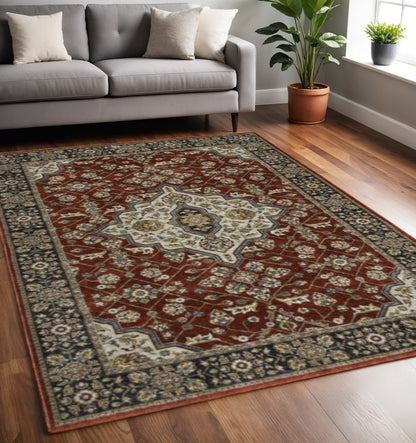 5' X 8' Red Ivory Blue Navy Gold And Grey Oriental Power Loom Stain Resistant Area Rug With Fringe