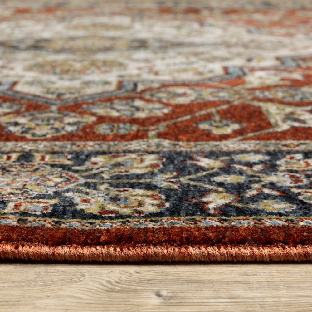5' X 8' Red Ivory Blue Navy Gold And Grey Oriental Power Loom Stain Resistant Area Rug With Fringe