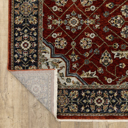 5' X 8' Red Ivory Blue Navy Gold And Grey Oriental Power Loom Stain Resistant Area Rug With Fringe
