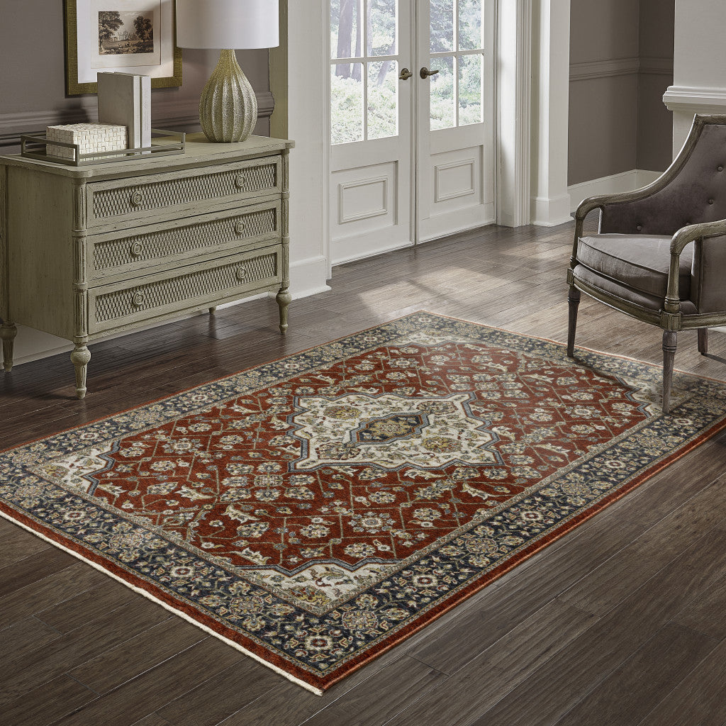 10' X 13' Red Ivory Blue Navy Gold And Grey Oriental Power Loom Stain Resistant Area Rug With Fringe