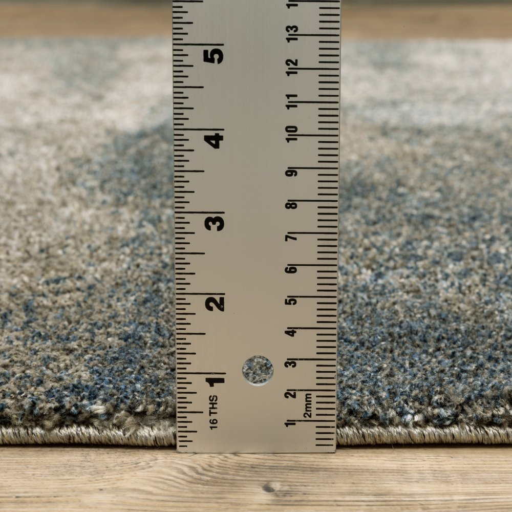 5' X 8' Beige And Blue Abstract Distressed Area Rug