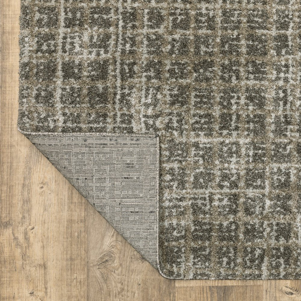 5' X 8' Brown And Beige Geometric Distressed Area Rug