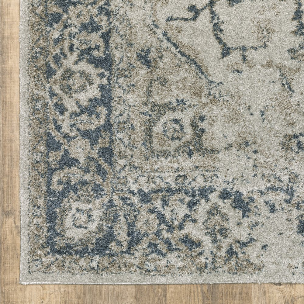 5' X 8' Beige And Blue Oriental Distressed Area Rug