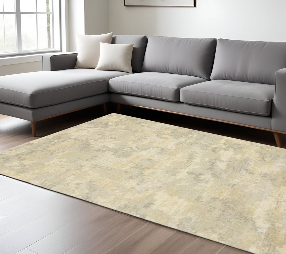6' X 9' Grey Ivory Beige And Taupe Abstract Power Loom Stain Resistant Area Rug