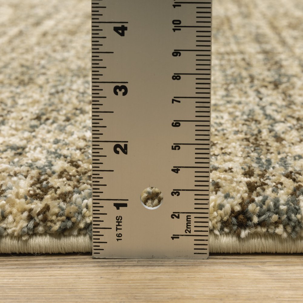 6' X 9' Beige Brown Tan And Blue Green Abstract Power Loom Stain Resistant Area Rug
