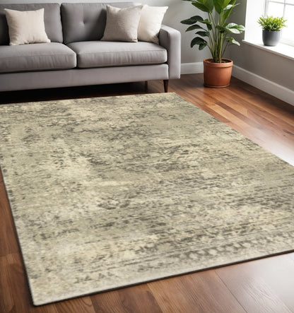 5' X 8' Grey Ivory Beige And Taupe Oriental Power Loom Stain Resistant Area Rug