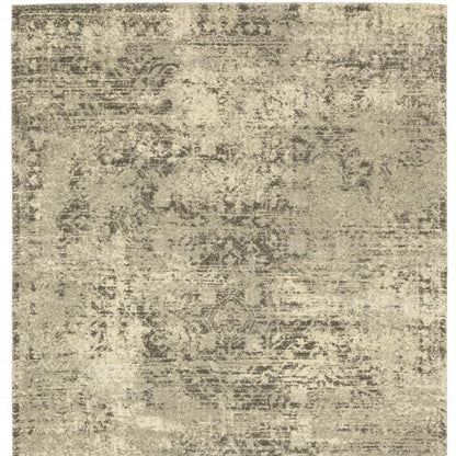 5' X 8' Grey Ivory Beige And Taupe Oriental Power Loom Stain Resistant Area Rug