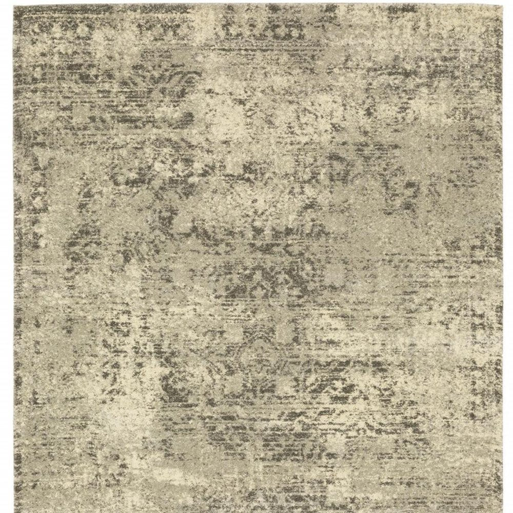5' X 8' Grey Ivory Beige And Taupe Oriental Power Loom Stain Resistant Area Rug