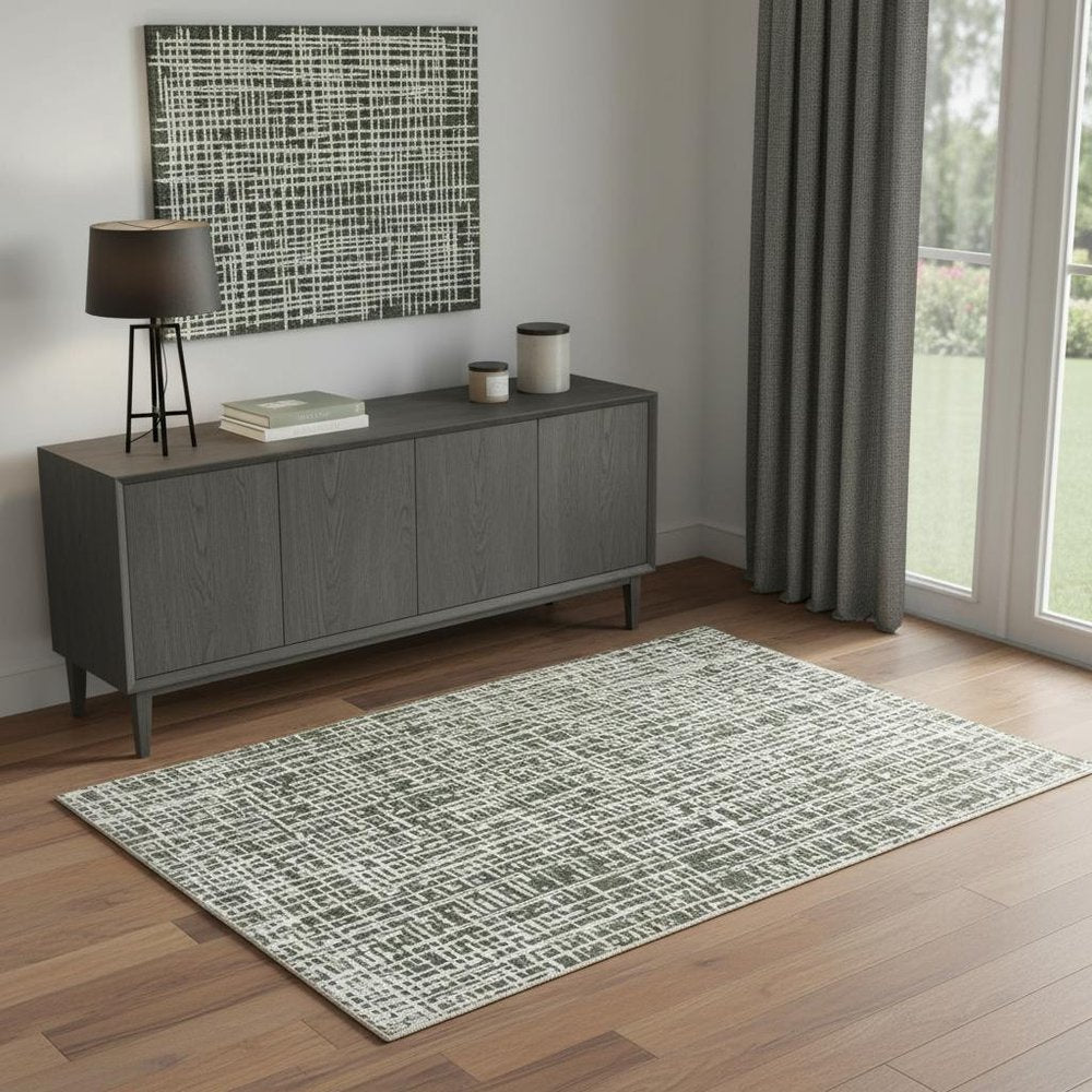 4' X 6' Grey And Ivory Abstract Power Loom Stain Resistant Area Rug