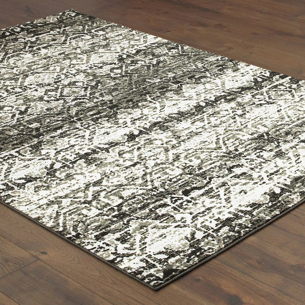 7' X 10' Gray And Ivory Geometric Distressed Area Rug