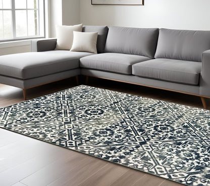 8' X 11' Navy Blue And Ivory Geometric Distressed Area Rug