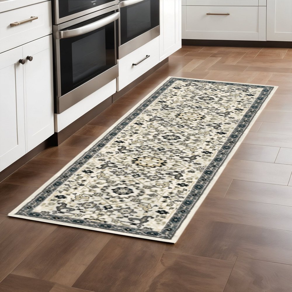 2' X 8' Ivory Navy And Gold Oriental Power Loom Stain Resistant Runner Rug