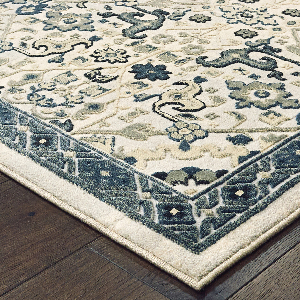 5' X 8' Ivory Navy And Gold Oriental Power Loom Stain Resistant Area Rug
