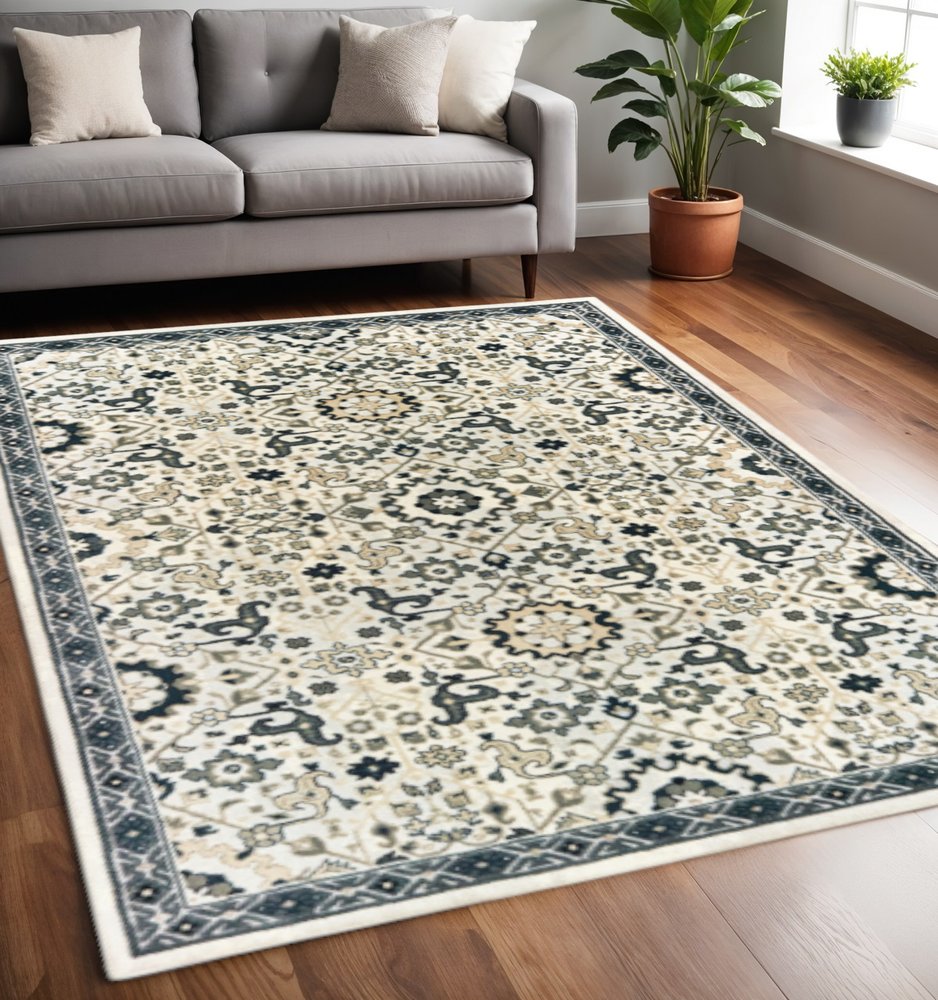 5' X 8' Ivory Navy And Gold Oriental Power Loom Stain Resistant Area Rug