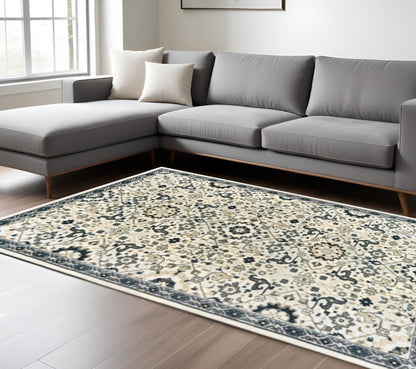 10' X 13' Ivory Navy And Gold Oriental Power Loom Stain Resistant Area Rug
