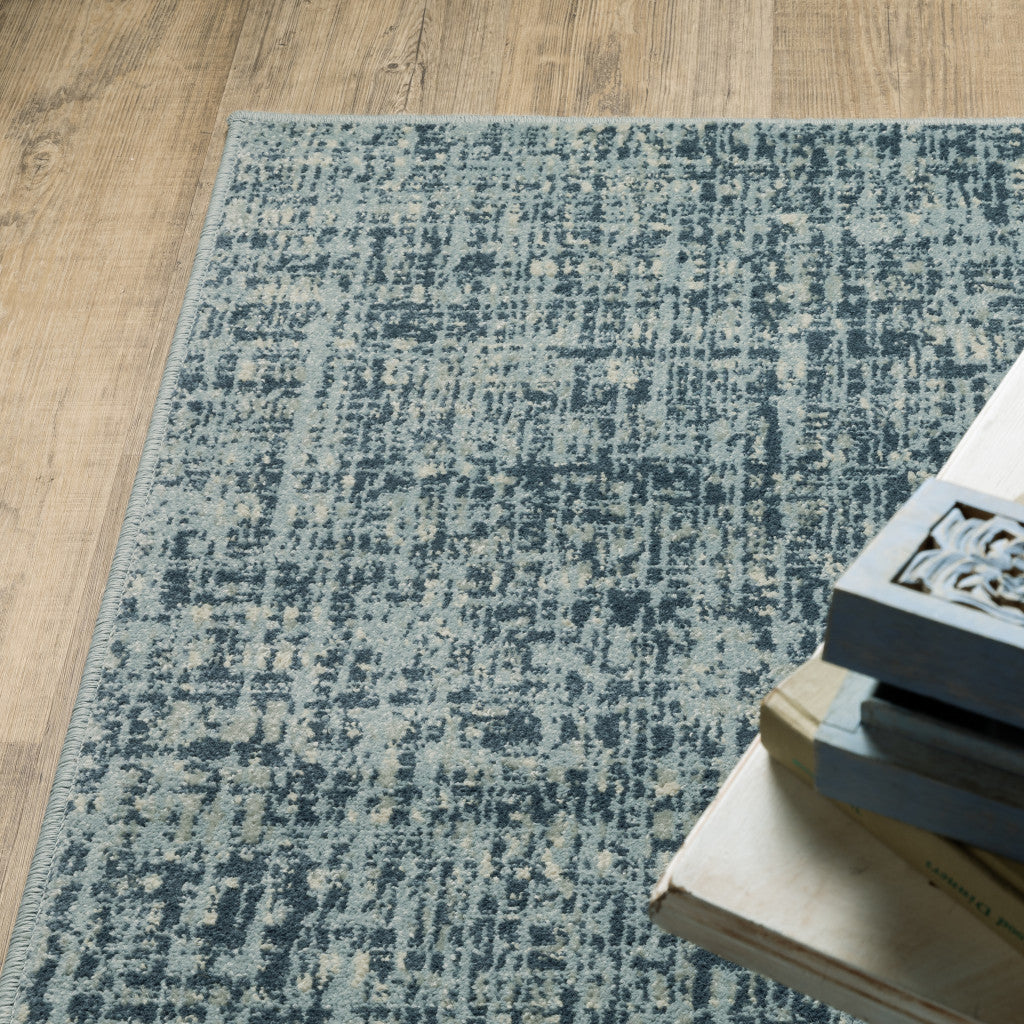 5' X 7' Dark Blue Light Blue Grey Ivory And Beige Abstract Power Loom Stain Resistant Area Rug