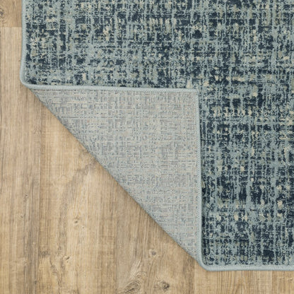 5' X 7' Dark Blue Light Blue Grey Ivory And Beige Abstract Power Loom Stain Resistant Area Rug